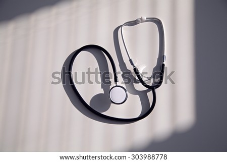 Black stethoscope in blue shade, close up