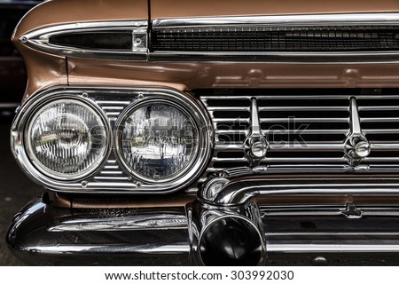 Front detail of a vintage car Royalty-Free Stock Photo #303992030