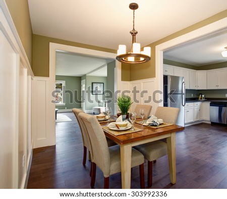 Modern dinning room with nice interior, and hardwood floor.