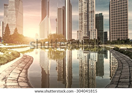 park and skyscrapers under the blue sky in shanghai