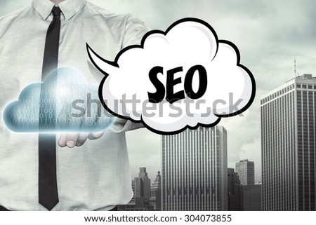 SEO text on cloud computing theme with businessman on cityscape background