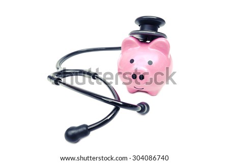 a stethoscope with pink piggy bank
