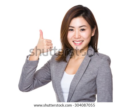 Asian young businesswoman with thumb up