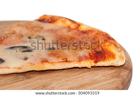 Slice of pizza on a kitchen wooden board.