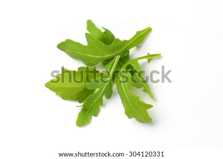 handful of fresh arugula leaves on white background Royalty-Free Stock Photo #304120331