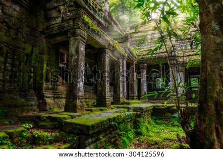 Among the ruins of Preah Khan in Siem Reap, Cambodia. Royalty-Free Stock Photo #304125596