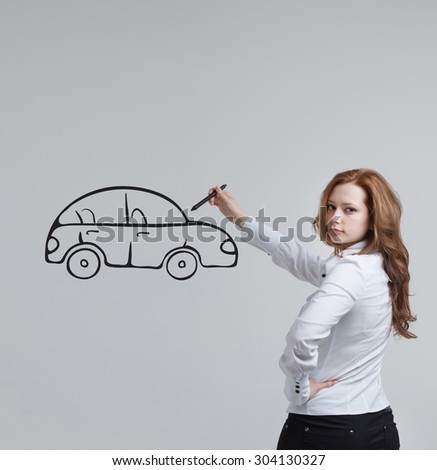 Young woman drawing car, concept on the subject of dreams or financial planning
