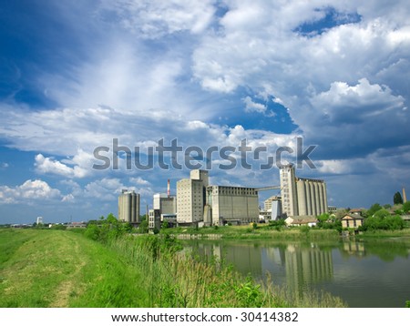 factory and silo on the river