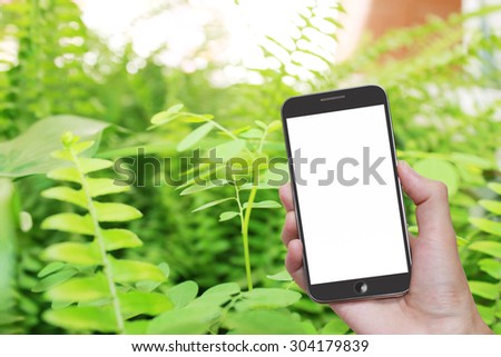 Man hand holding mobile smart phone with blank screen