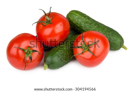 Heap of fresh cucumbers and tomatoes isolated on white background