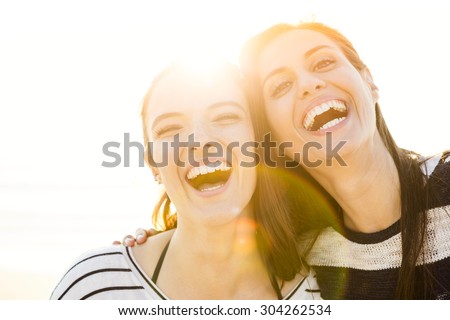 A portrait of best friends laughing  Royalty-Free Stock Photo #304262534