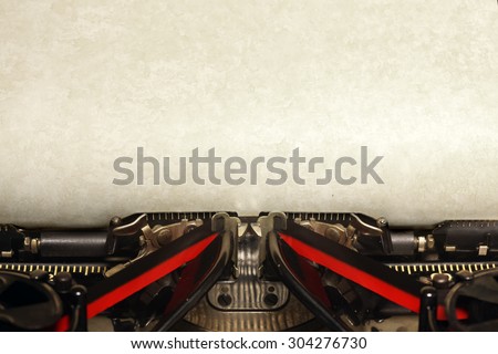 Old vintage typewriter with blank paper Royalty-Free Stock Photo #304276730