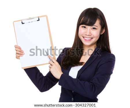 Businesswoman pen point to clipboard