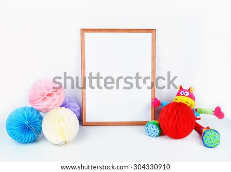 Frame mock up background, kids objects, white wall, paper colorful balls.