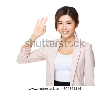 Asian Young businesswoman with ok sign gesture