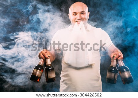 happy man with lots of beer on a black background