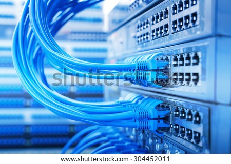 Network panel, switch and cable in data center Royalty-Free Stock Photo #304452011