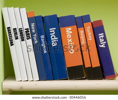 Travel guide books on a shelf Royalty-Free Stock Photo #30446056