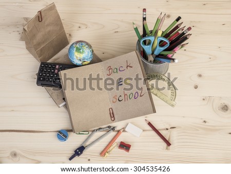 back to school template with multiple stationery on table