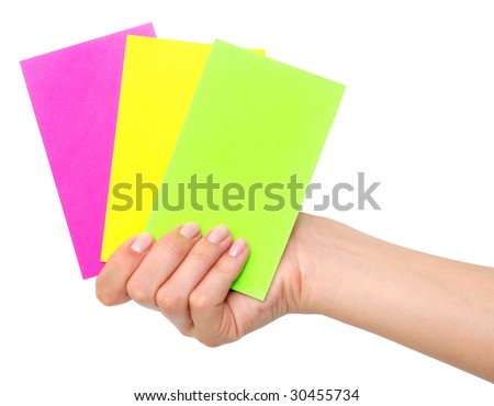 colored paper cards in hand isolated on white