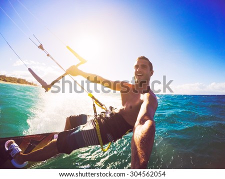 Kiteboarding. Fun in the ocean, Extreme Sport Kitesurfing. POV Angle with Action Camera  Royalty-Free Stock Photo #304562054