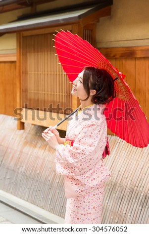 attractive asian woman wearing traditional Japanese Kimono