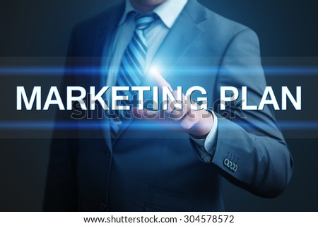 business, technology, internet and networking concept - businessman pressing marketing plan button on virtual screens