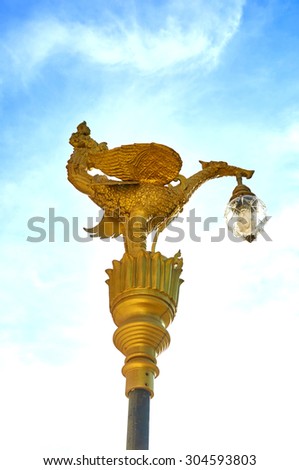 Garuda golden lamp in the temple in Thailand.