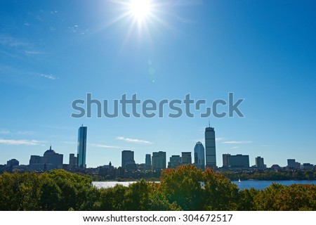 Boston skyline view with sun backlight from Cambridge at Massachusetts, USA