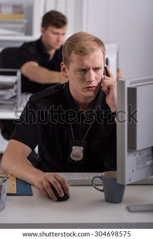 Picture of young man working on police helpline