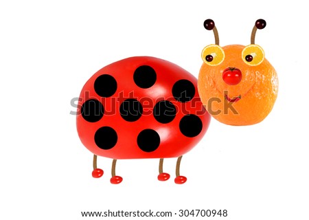 Creative food concept. Funny little  ladybird made from fruit and vegetables