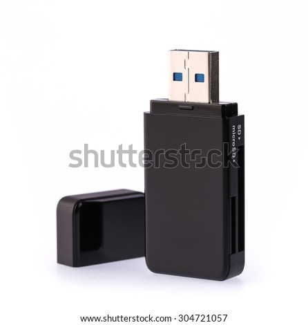 Black USB memory stick isolated on white background Royalty-Free Stock Photo #304721057