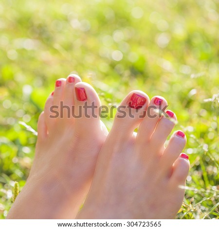 Female barefoot in the grass