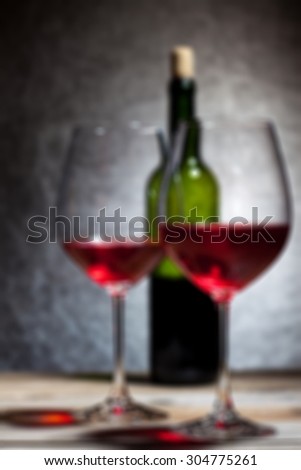 red wine in glass and bottle. romantic blur effect