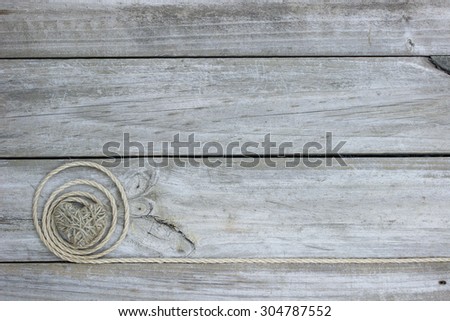 Blank rustic wood sign with rope and country heart border 