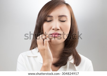 Young beautiful woman scraching her labia