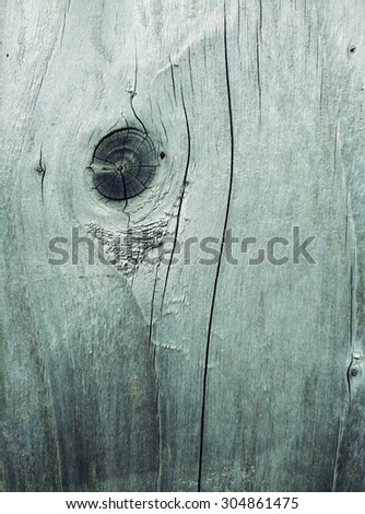 texture of a aged wooden boards with a knot, close up