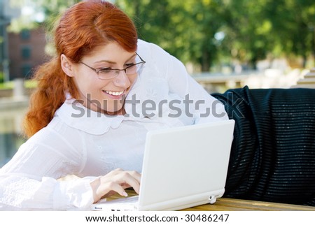 picture of happy businesswoman in the park