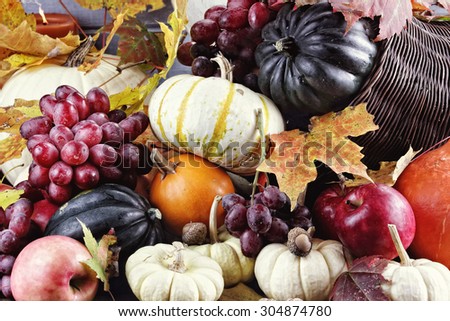 Cornucopia or Horn of Plenty with lots of fresh vegetables and fruit spilling out. 