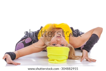 Fair-haired girl on occupations by gymnastics, is isolated on white background.