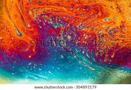 Psychedelic patterns formed on the surface of soap bubbles Royalty-Free Stock Photo #304893179