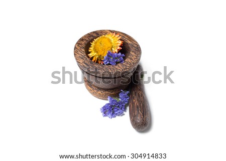 Wooden brown sandalwood pounder flowers isolated on white. Good for spa salon, banners, sites, homemade cosmetics, brochures, advertising, etc