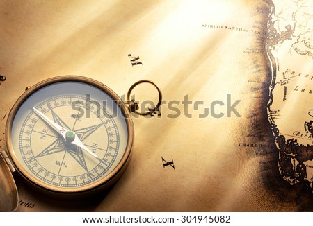 Vintage compass on old map