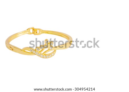 Gold bracelets adorned with diamonds. Fake jewelry. Clipping path in picture.