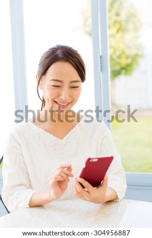 young asian woman relaxing in the cafe