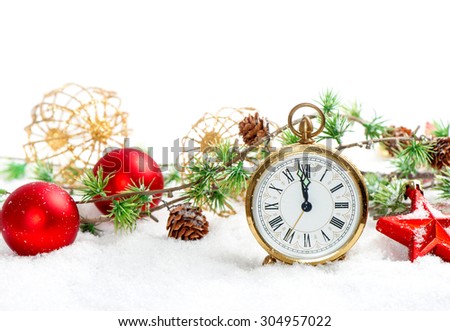 Vintage christmas decoration red baubles and antique golden clock in snow on white background
