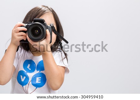 Child Holding Camera