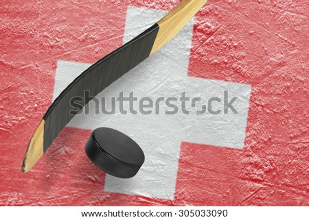 Hockey puck, stick and a fragment of an image of the Swiss flag