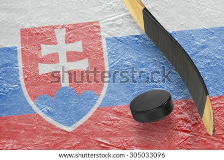 Hockey puck, stick and a fragment of an image of the Slovak flag