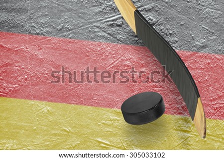 Hockey puck, stick and a fragment of an image of the German flag
